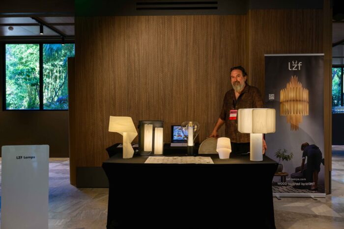 Exhibition stand during the event in Athens, Sandro Tothill next to him, with some of our table models: Air, Eris, Tiny and Kactos.